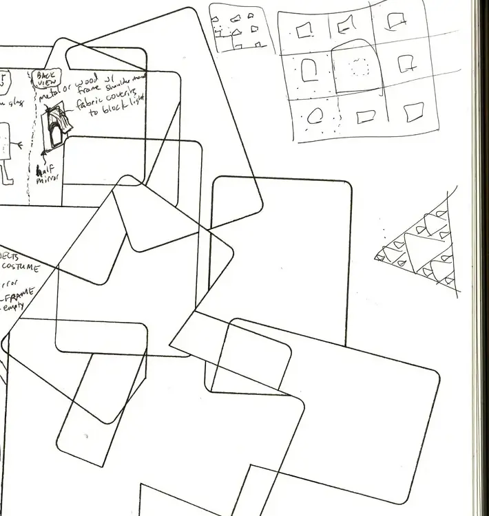 A spiral sketchbook page with overlapping rounded rectangles drawn in pen and a small grid sketch in the corner